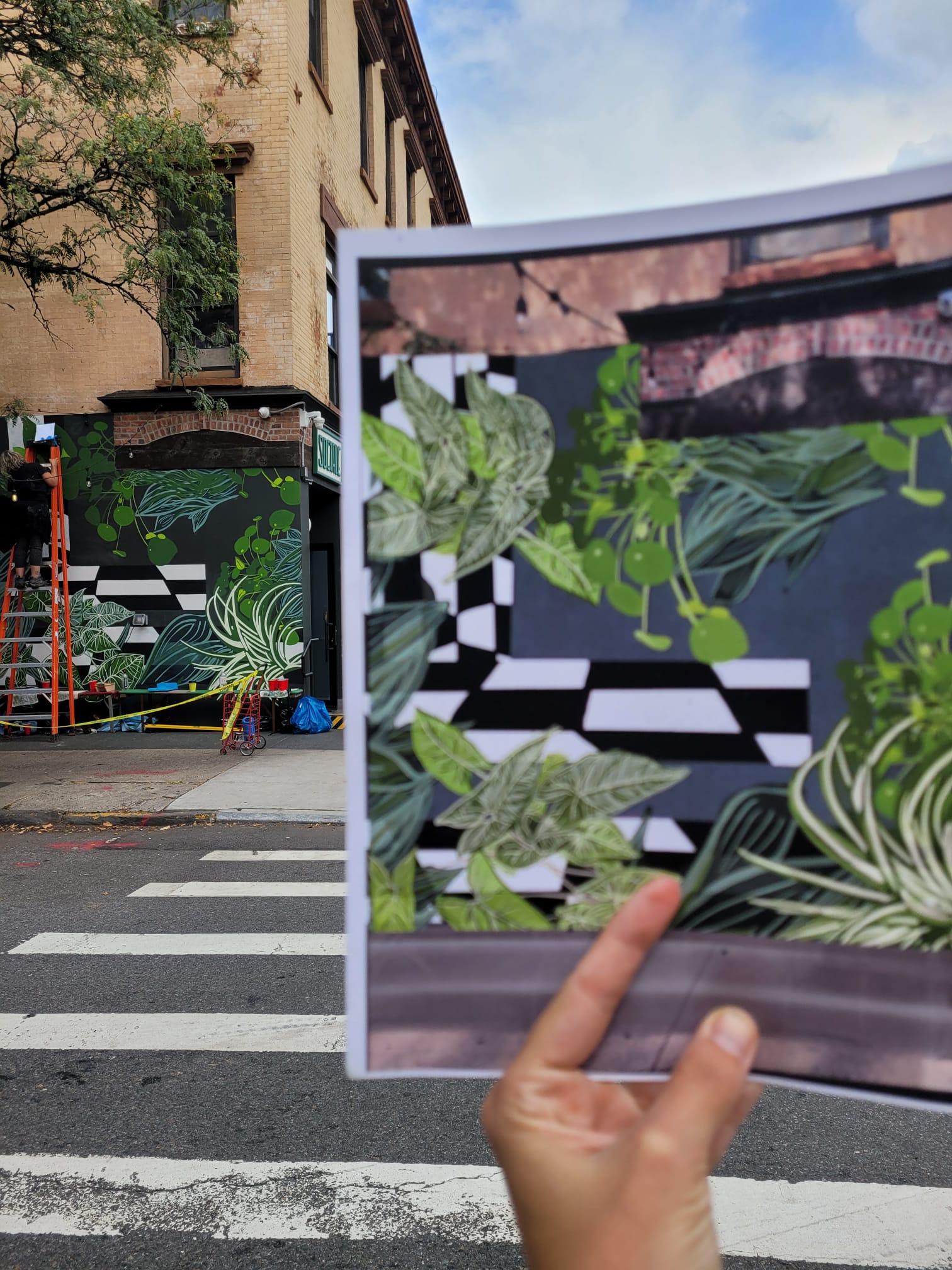 Artists painting a mural in NYC
